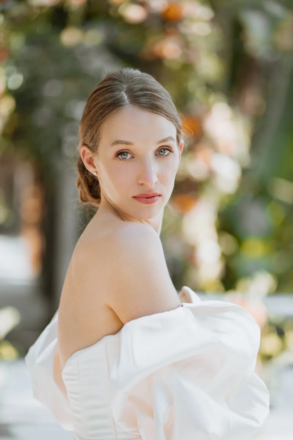 Outdoor bridal beauty portrait with softly styled hair