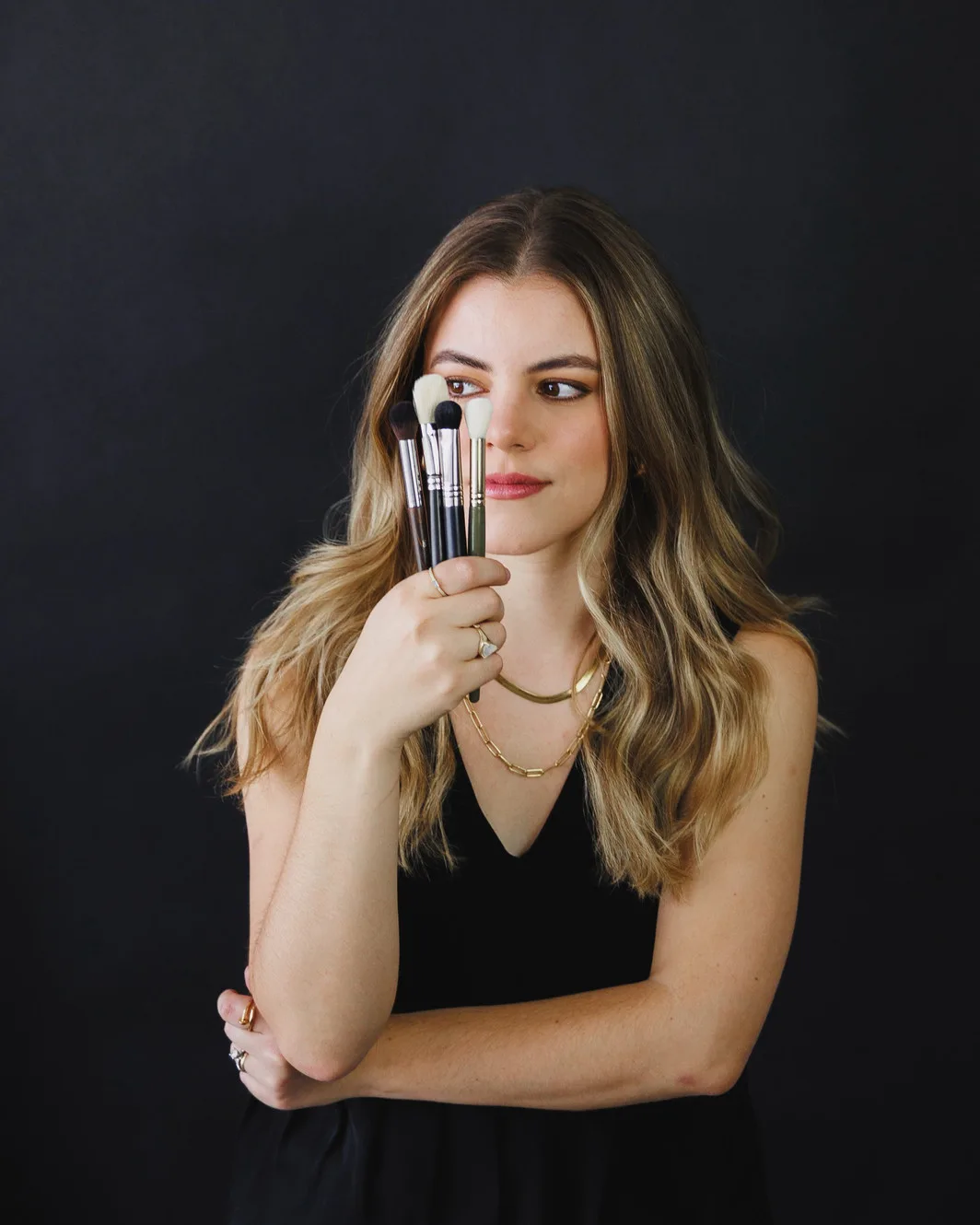 Lucy Muma demonstrating professional bridal makeup artistry