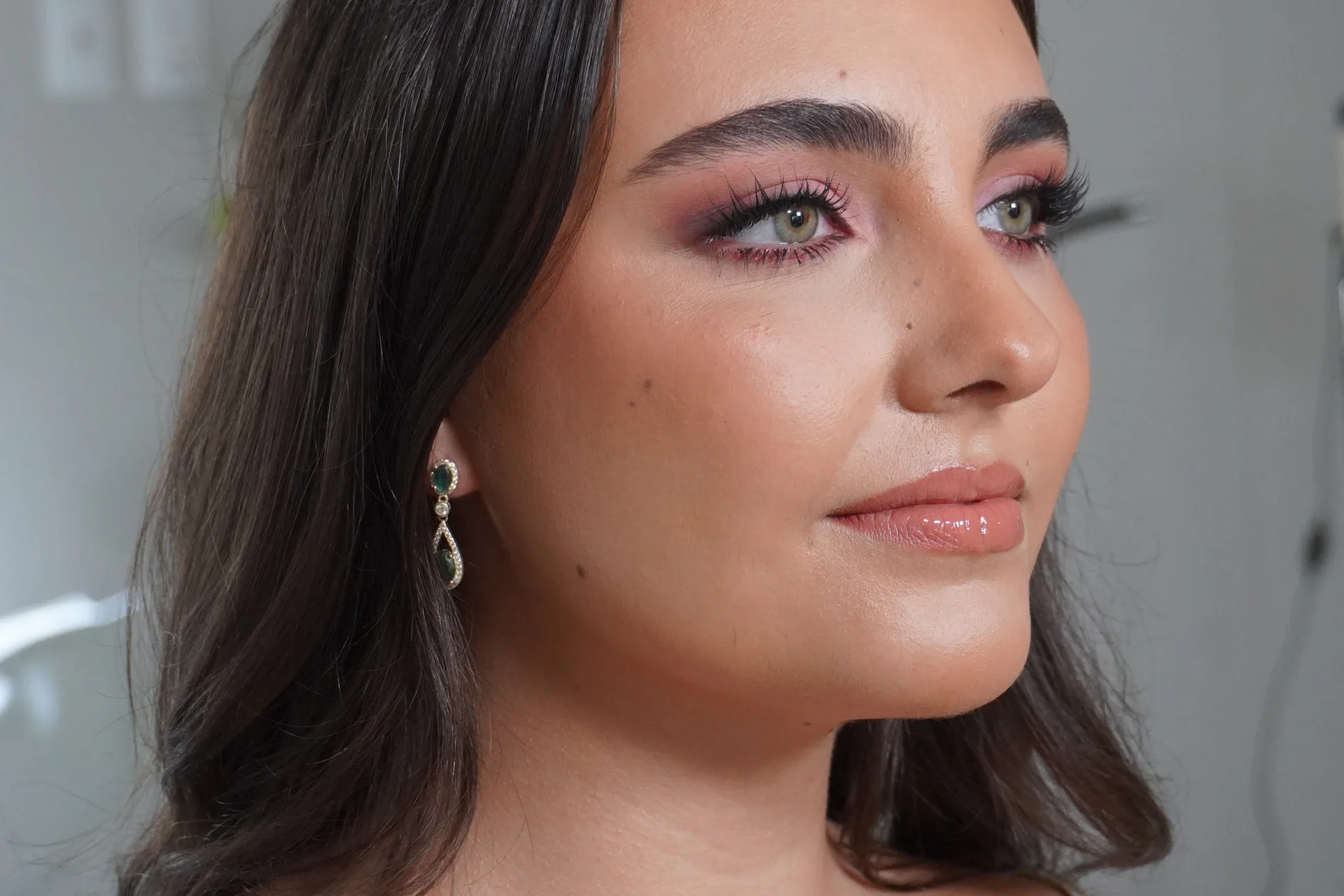 Close bridal portrait with luminous pink-toned makeup by Lucy Muma