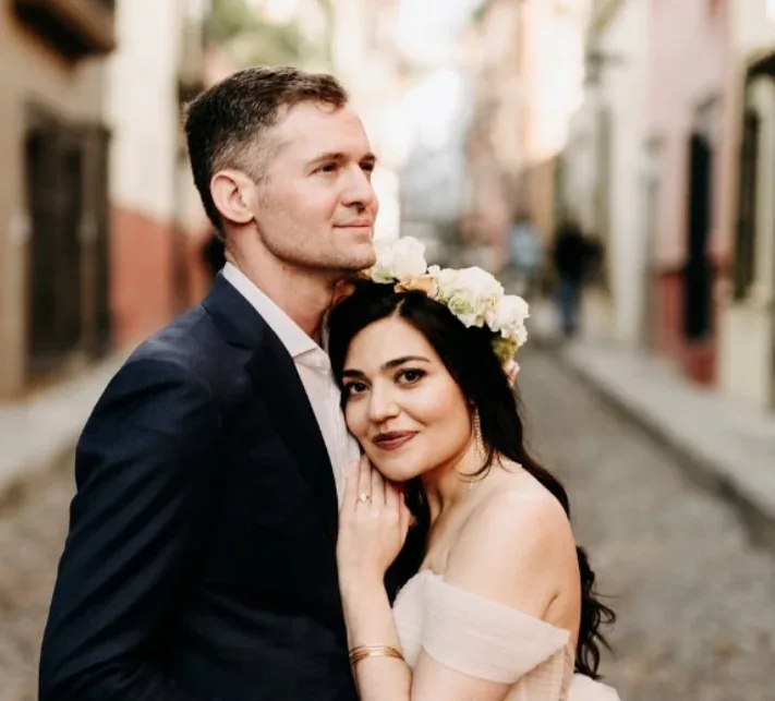Bride and groom portrait highlighting a romantic bridal beauty look