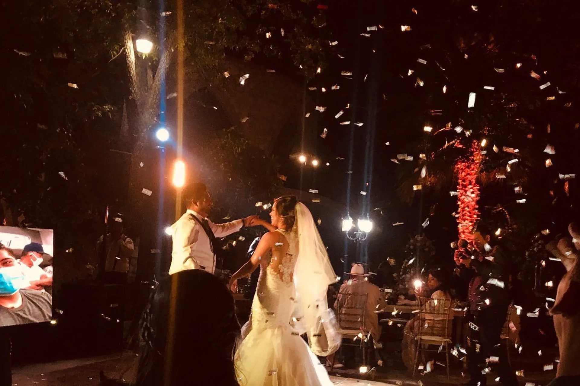 Live reception performance with stage lighting and cold sparks