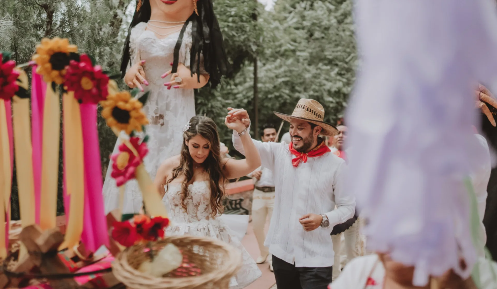 Bride and groom dancing during a colorful traditional wedding celebration