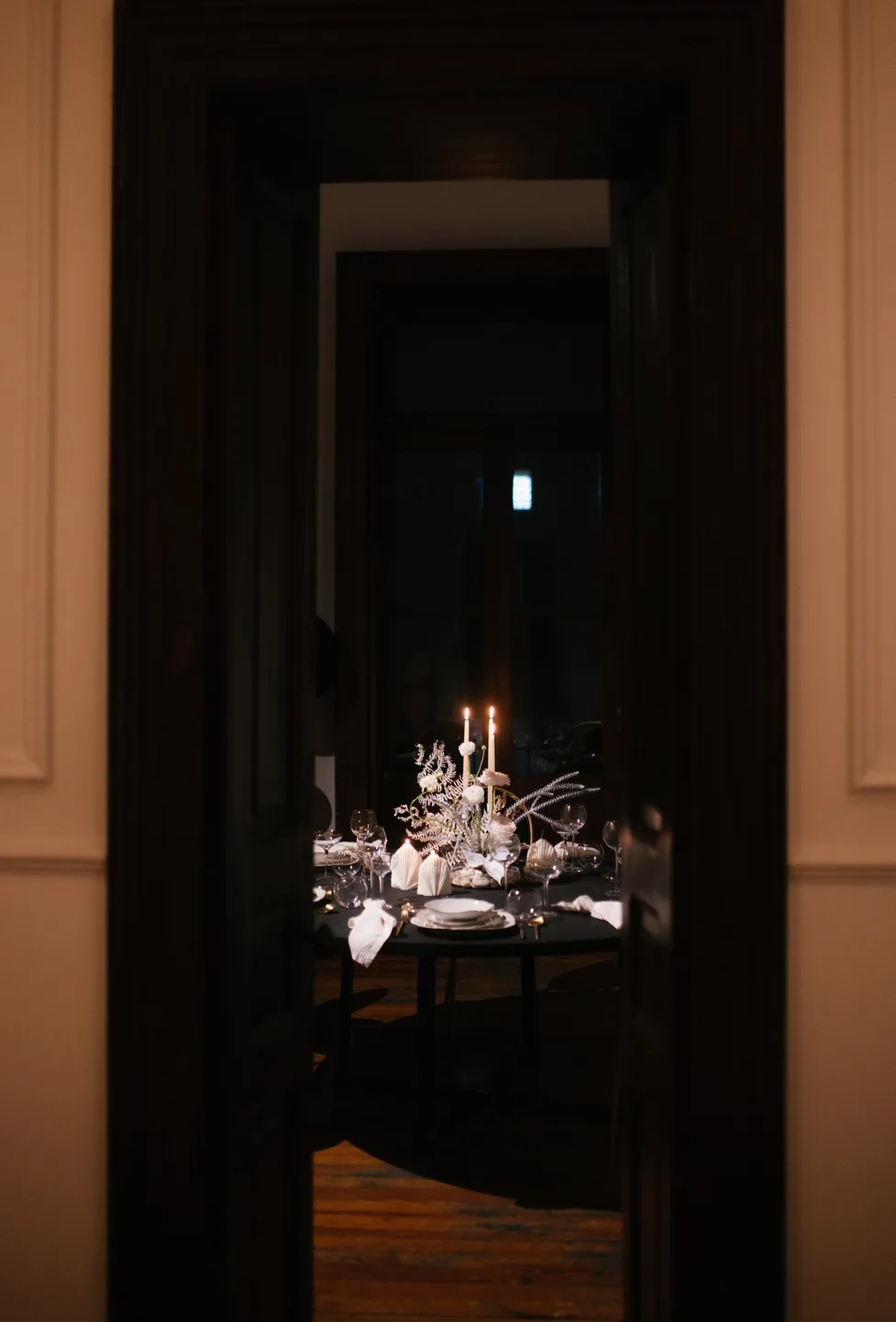 Atmospheric wedding dinner styled with designer rentals
