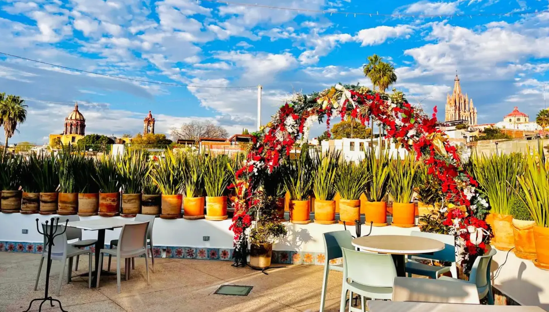 Floral ceremony arch on the Casa 1810 rooftop overlooking San Miguel de Allende