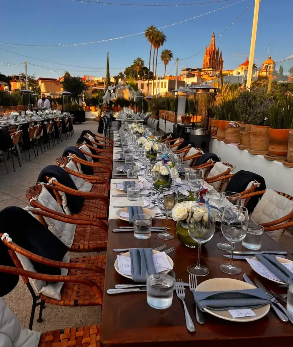 Long reception table prepared for dinner on the Casa 1810 rooftop
