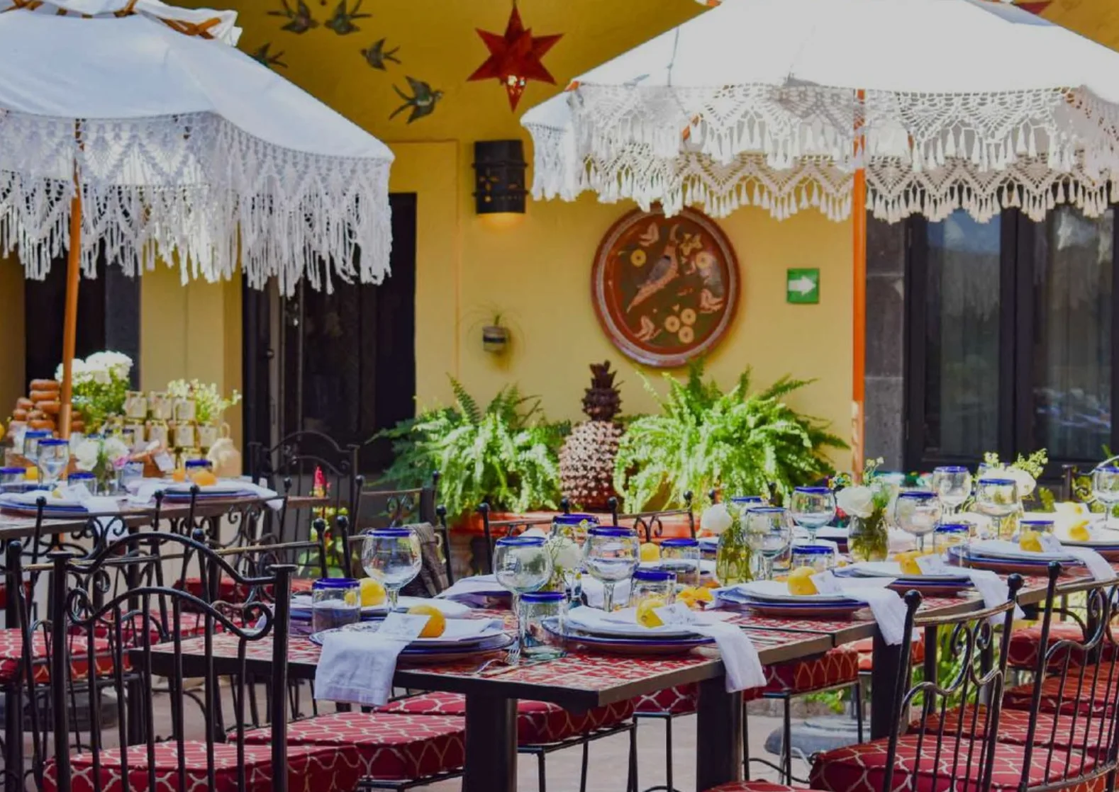 Courtyard tables arranged for an intimate celebration at Hacienda El Santuario