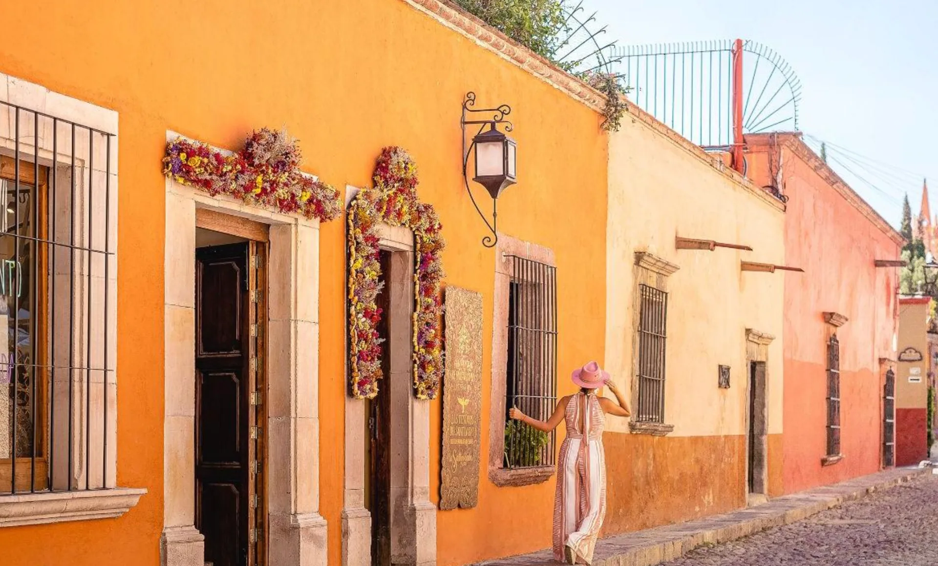 Colorful historic facade of Hacienda El Santuario on Aldama Street