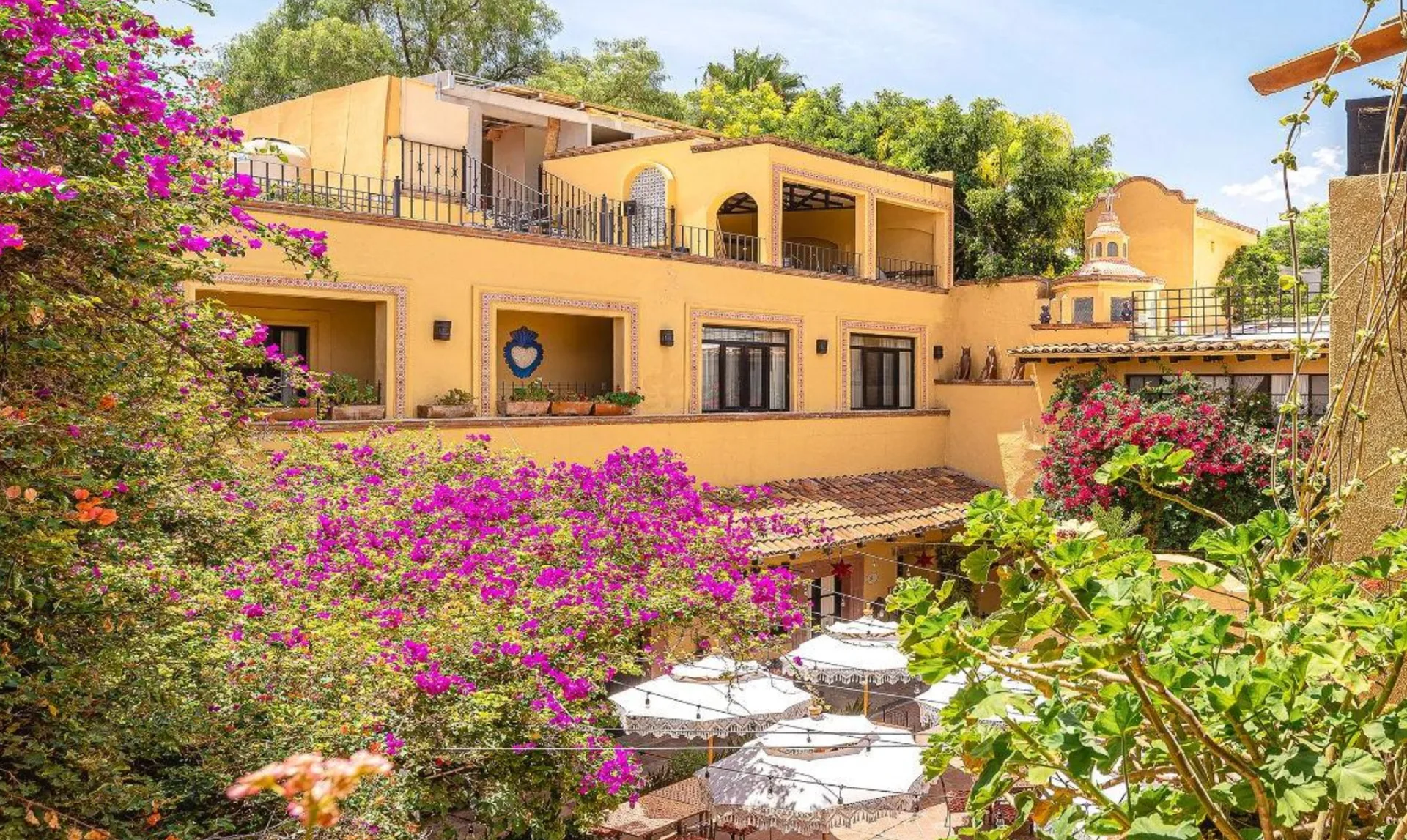 Bougainvillea-filled courtyard and historic architecture at Hacienda El Santuario