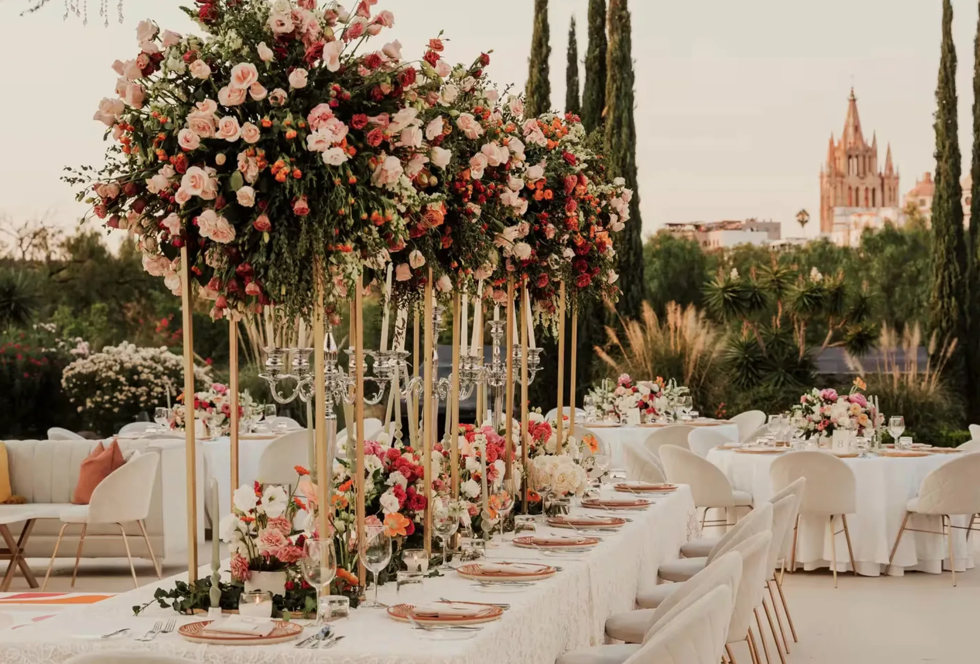 Floral garden wedding reception with La Parroquia in the background at Rosewood